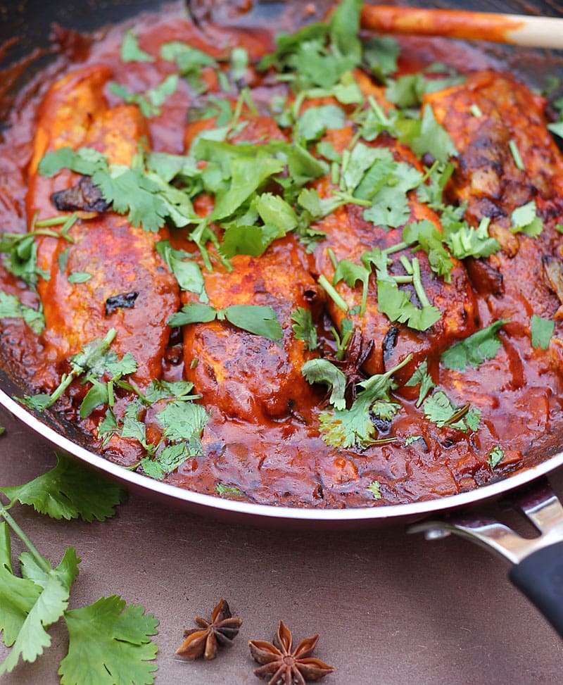 The rich color of this curry is from the paprika, cumin, coriander, cayenne and turmeric I dredged the fish with before cooking them in a tomato, ginger, garlic, onion and coconut milk sauce. @RunninSrilankan