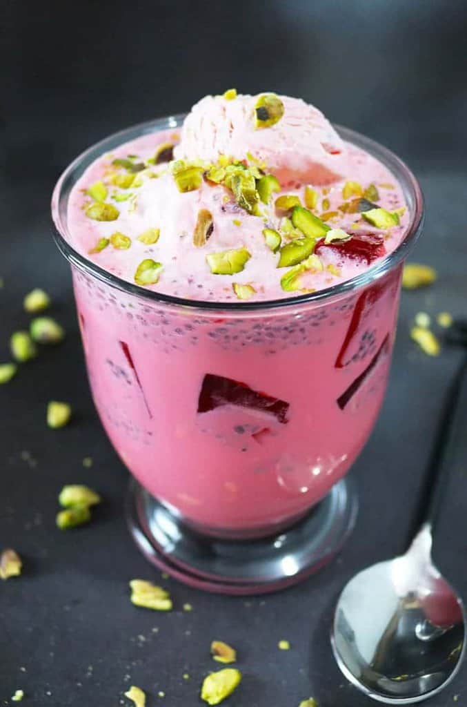 Falooda - A cool and delicious rose water and rose syrup beverage with basil seeds, tapioca pearls and almond extract, served with ice cream it will become a summer favorite